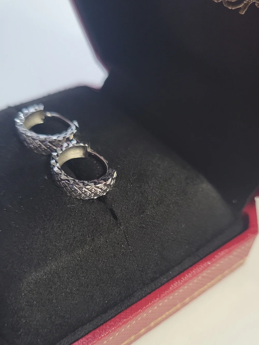 18 KT White Gold Diamond Cut Infinity Earrings